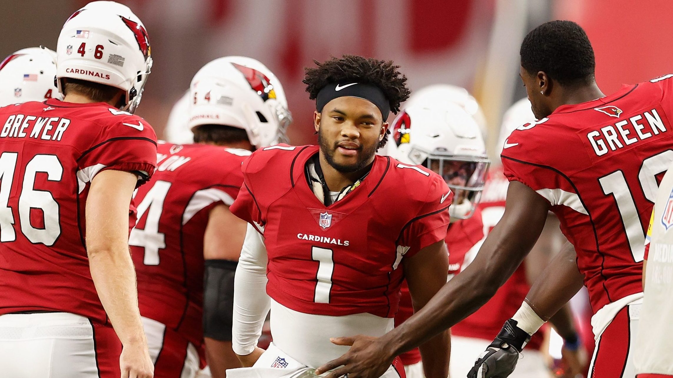 Quarterback Kyler Murray #1 of the Arizona Cardinals is greeted by A.J. Green #18 during introducti...