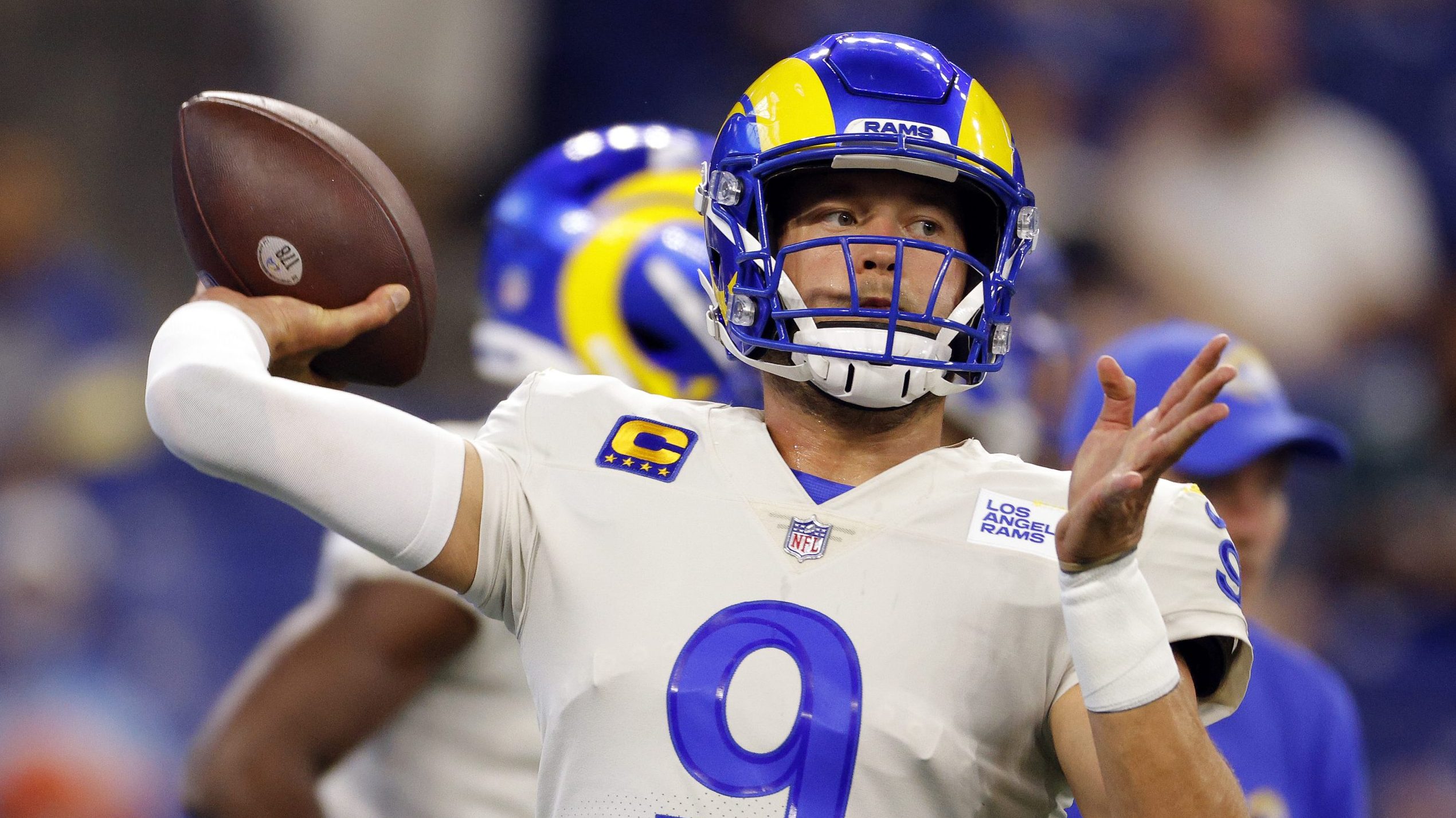 Quarterback Matthew Stafford #9 of the Los Angeles Rams warms up before the game against the Indian...