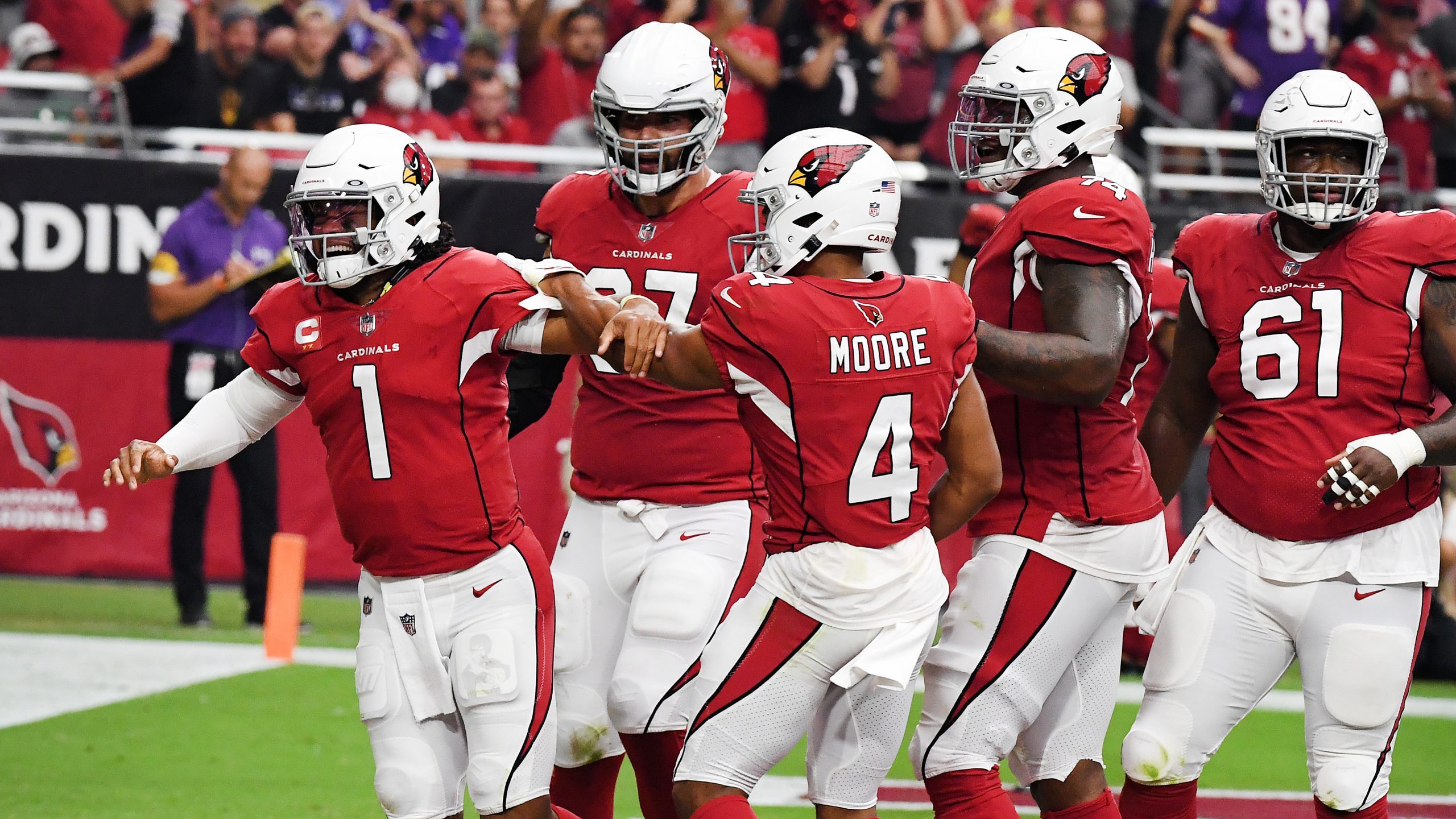 Quarterback Kyler Murray #1 of the Arizona Cardinals celebrates in the end zone after scoring a rus...