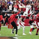 Jonathan Ward #29 of the Arizona Cardinals does a back flip as teammates celebrate on the field after the Minnesota Vikings missed on their game-winning field goal attempt in the fourth quarter of the game at State Farm Stadium on September 19, 2021 in Glendale, Arizona. (Photo by Norm Hall/Getty Images)