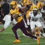 Arizona State quarterback Jayden Daniels (5) runs for a first down against Colorado State's defense during the first half of an NCAA college football game Sat, Sept 25, 2021, in Tempe, Ariz. (AP Photo/Darryl Webb)