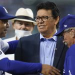 Former Los Angeles Dodgers pitcher Fernando Valenzuela, center, greets Dodgers manager Dave Roberts, left, during a ceremony honoring Valenzuela before a baseball game between the Arizona Diamondbacks and the Los Angeles Dodgers Wednesday, Sept. 15, 2021, in Los Angeles. (AP Photo/Ashley Landis)