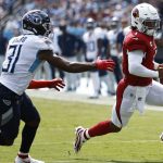 Arizona Cardinals quarterback Kyler Murray (1) scrambles away from Tennessee Titans free safety Kevin Byard (31) in the first half of an NFL football game Sunday, Sept. 12, 2021, in Nashville, Tenn. (AP Photo/Wade Payne)