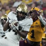 Colorado State wide receiver Dimitri Stanley (14) hauls in a pass against Arizona State defensive back Jordan Clark (1) during the first half of an NCAA college football game Sat, Sept 25, 2021, in Tempe, Ariz. (AP Photo/Darryl Webb)