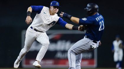 Arizona Diamondbacks second baseman Andrew Young tags out Seattle Mariners' Ty France (23) on a for...