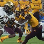 Arizona State defensive back Jordan Clark (1) drags down Colorado State wide receiver Dimitri Stanley (14) during the first half of an NCAA college football game Sat, Sept 25, 2021, in Tempe, Ariz. (AP Photo/Darryl Webb)