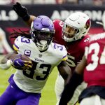 Minnesota Vikings running back Dalvin Cook (33) avoids the tackles of Arizona Cardinals linebacker Zaven Collins during the first half of an NFL football game, Sunday, Sept. 19, 2021, in Glendale, Ariz. (AP Photo/Rick Scuteri)