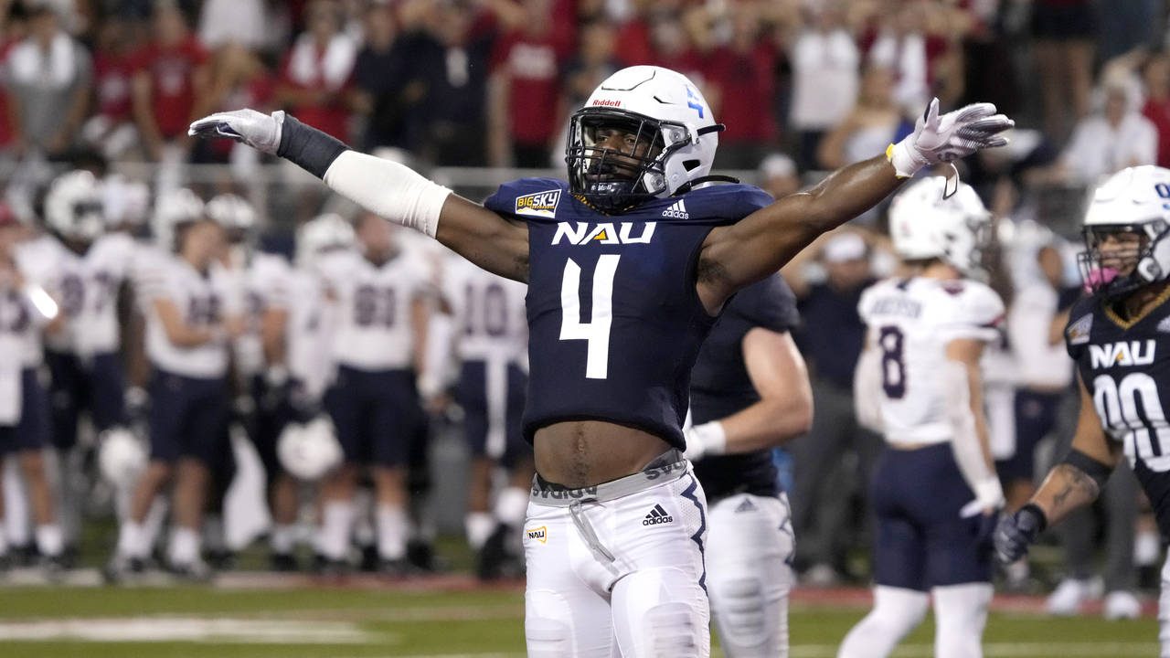 Northern Arizona defensive back Brenndan Johnson (4) reacts after stopping Arizona on a two point c...