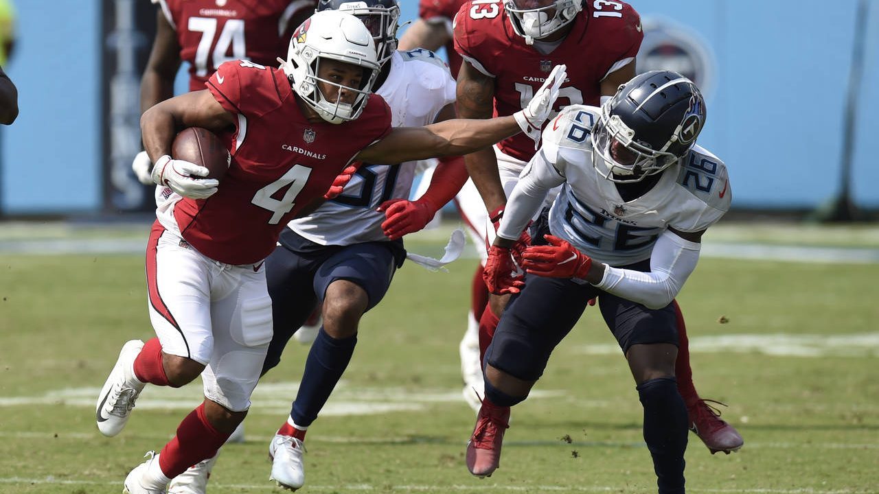 Arizona Cardinals wide receiver Rondale Moore (4) carries the ball against Tennessee Titans cornerb...