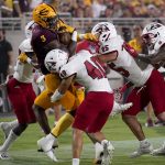 Arizona State running back Rachaad White (3) is stopped at the goal line by Southern Utah linebacker Jayden Clark (25) and safety Treyson Johnson (40) during the first half of an NCAA college football game, Thursday, Sept. 2, 2021, in Tempe, Ariz. (AP Photo/Matt York)