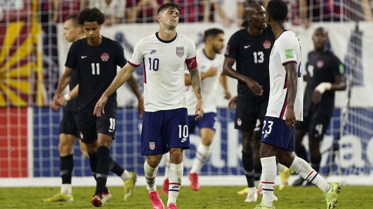 United States forward Christian Pulisic (10) reacts to missing a shot against Canada during the sec...