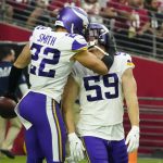 Minnesota Vikings outside linebacker Nick Vigil (59) celebrates his interception for a touchdown with free safety Harrison Smith (22) during the second half of an NFL football game against the Arizona Cardinals, Sunday, Sept. 19, 2021, in Glendale, Ariz. (AP Photo/Rick Scuteri)