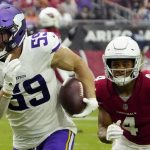 Minnesota Vikings outside linebacker Nick Vigil (59) run back an interception for a touchdown as Arizona Cardinals wide receiver Rondale Moore (4) pursues during the second half of an NFL football game, Sunday, Sept. 19, 2021, in Glendale, Ariz. (AP Photo/Rick Scuteri)