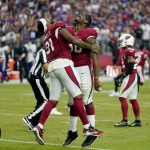 Arizona Cardinals tight end Darrell Daniels (81) and Arizona Cardinals safety James Wiggins celebrate after an NFL football game against the Minnesota Vikings, Sunday, Sept. 19, 2021, in Glendale, Ariz. The Cardinals won 34-33. (AP Photo/Ross D. Franklin)