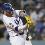 Los Angeles Dodgers' Justin Turner singles during the fifth inning of a baseball game against the Arizona Diamondbacks Wednesday, Sept. 15, 2021, in Los Angeles. (AP Photo/Ashley Landis)