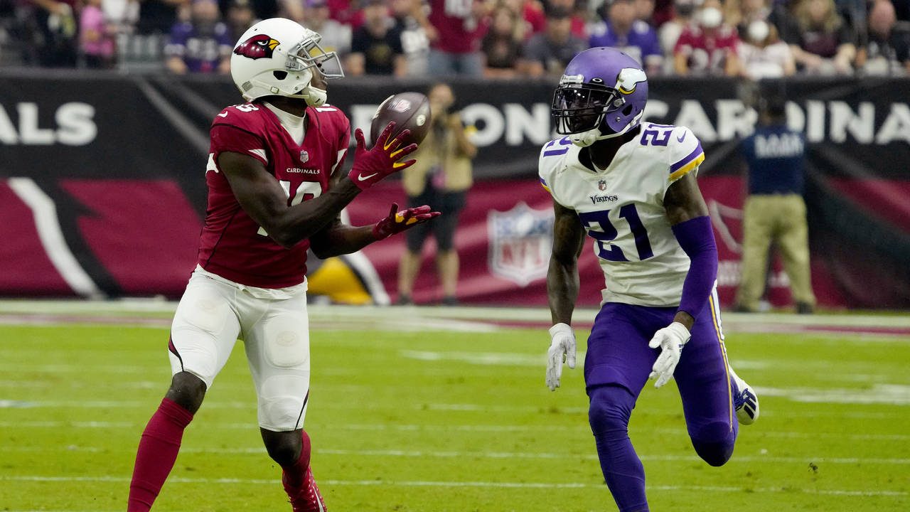 Arizona Cardinals wide receiver A.J. Green pulls in a catch as Minnesota Vikings defensive back Bas...