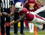 Arizona Cardinals wide receiver A.J. Green (18) scores against the Minnesota Vikings during the second half of an NFL football game, Sunday, Sept. 19, 2021, in Glendale, Ariz. (AP Photo/Ross D. Franklin)