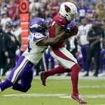 Arizona Cardinals wide receiver Christian Kirk (13) pulls in a catch as Minnesota Vikings cornerback Mackensie Alexander defends during the second half of an NFL football game, Sunday, Sept. 19, 2021, in Glendale, Ariz. (AP Photo/Ross D. Franklin)