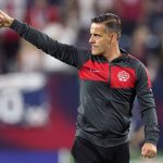 Canada head coach John Herdman salutes the crowd as he leaves the pitch following a 1-1 draw against the United States in a World Cup soccer qualifier Sunday, Sept. 5, 2021, in Nashville, Tenn. (AP Photo/Mark Humphrey)