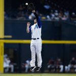 Arizona Diamondbacks third baseman Josh VanMeter jumps to make a catch on a line drive hit by Seattle Mariners' Ty France during the sixth inning of a baseball game Sunday, Sept. 5, 2021, in Phoenix. (AP Photo/Ross D. Franklin)