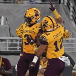 Arizona State running back Rachaad White (3) and tight end Jalin Conyers (12) celebrate White's touchdown against Colorado during the first half of an NCAA college football game Saturday, Sept 25, 2021, in Tempe, Ariz. (AP Photo/Darryl Webb)
