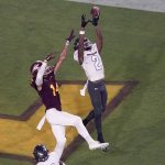 UNLV defensive back Nohl Williams (2) intercepts a pass in the end zone intended for Arizona State wide receiver Johnny Wilson (14) during the first half of an NCAA college football game, Saturday, Sept. 11, 2021, in Tempe, Ariz. (AP Photo/Matt York)