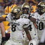 Colorado tailback Alex Fontenot (8) signals touchdown with his offensive tight end Matt Lynch (84) and lineman Jake Wiley (60) after scoring against Arizona State during the second half of an NCAA college football game Saturday Sept. 25, 2021, in Tempe, Ariz. (AP Photo/Darryl Webb)