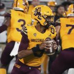 Arizona State quarterback Jayden Daniels (5) rolls out to throw a pass against Colorado during the second half of an NCAA college football game Sat, Sept 25, 2021, in Tempe, Ariz. (AP Photo/Darryl Webb)