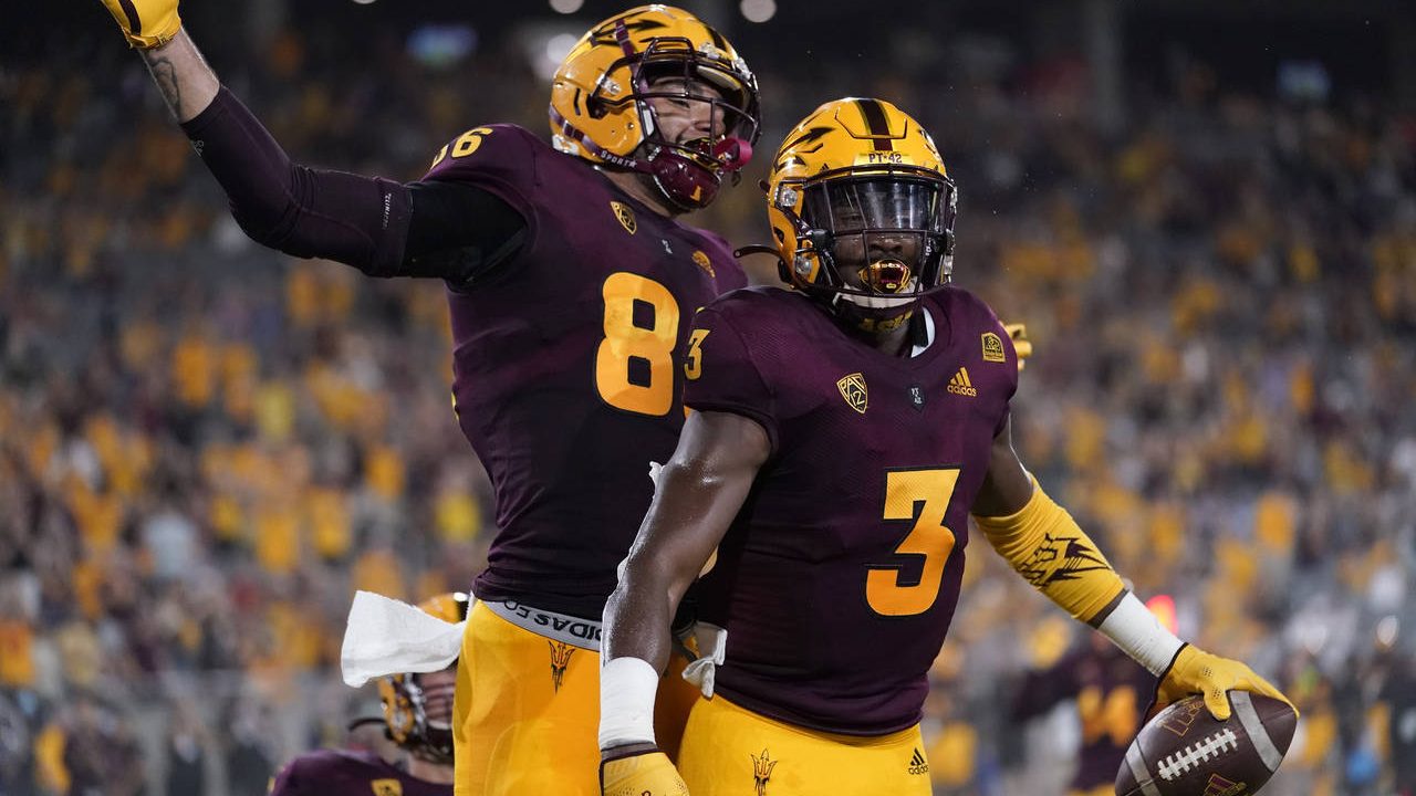 Arizona State running back Rachaad White (3) celebrates his touchdown with tight end Curtis Hodges ...