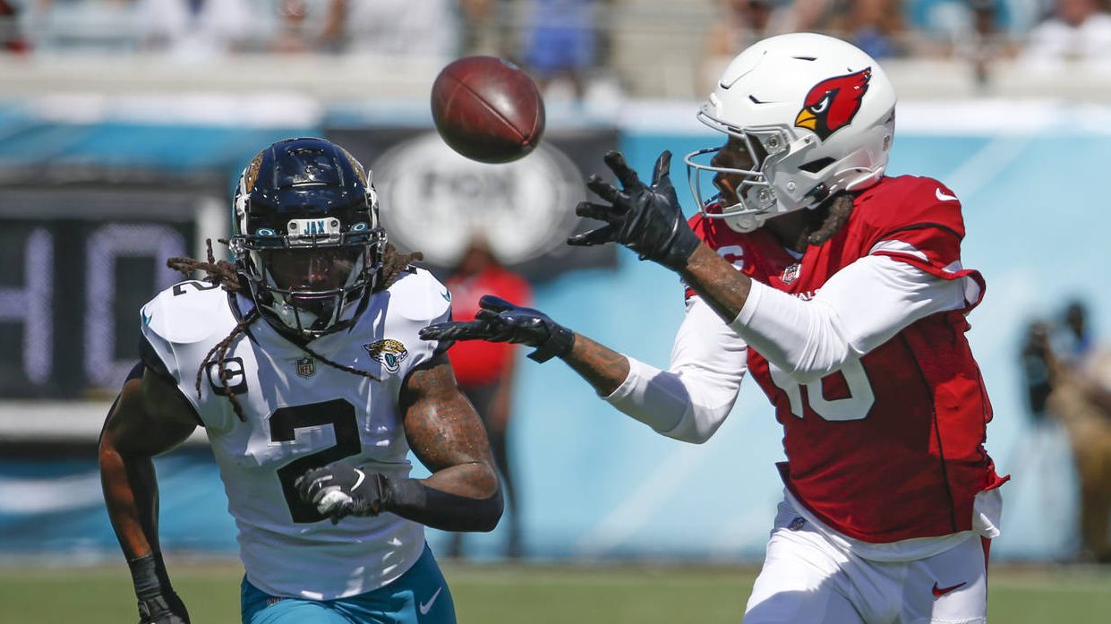 Arizona Cardinals wide receiver DeAndre Hopkins, right, makes a reception in front of Jacksonville ...