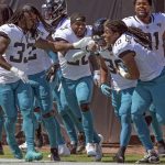 Jacksonville Jaguars players celebrate with wide receiver Jamal Agnew, second from right, after he ran back a missed field goal for a 109-yards for a touchdown against the Arizona Cardinals during the first half of an NFL football game, Sunday, Sept. 26, 2021, in Jacksonville, Fla. (AP Photo/Phelan M. Ebenhack)