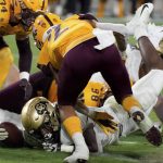 Colorado tailback Alex Fontenot (8) dives across the goal line scoring their first touchdown against Arizona State defense during the second half of an NCAA college football game Saturday, Sept 25, 2021, in Tempe, Ariz. (AP Photo/Darryl Webb)