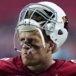 
              Arizona Cardinals defensive end J.J. Watt watches from the sidelines against the Minnesota Vikings during the first half of an NFL football game, Sunday, Sept. 19, 2021, in Glendale, Ariz. (AP Photo/Ross D. Franklin)
            