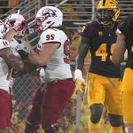 Southern Utah wide receiver Judd Cockett celebrates his touchdown against Arizona State with defensive lineman Mark Kruger (95) and wide receiver Lance Lawson (14) during the first half of an NCAA college football game, Thursday, Sept. 2, 2021, in Tempe, Ariz. (AP Photo/Matt York)