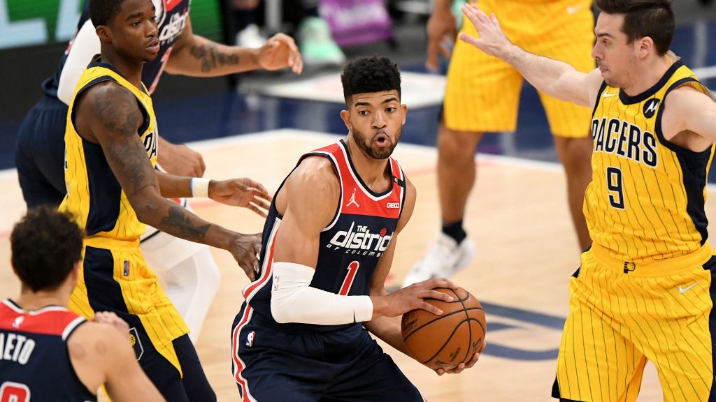 Chandler Hutchison #1 of the Washington Wizards looks to pass in front of T.J. McConnell #9 of the ...