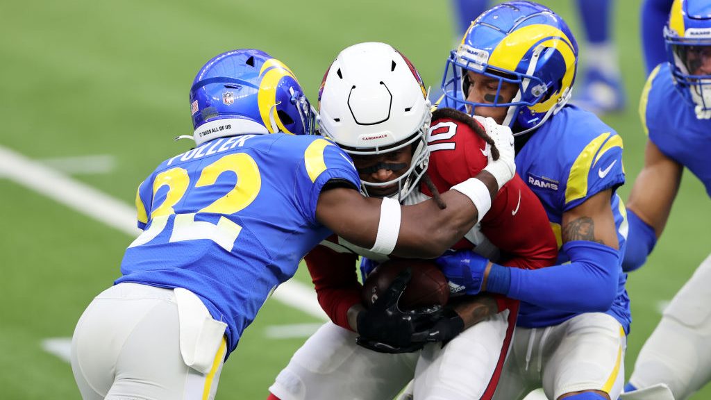 DeAndre Hopkins #10 of the Arizona Cardinals is tackled by Jordan Fuller #32 of the Los Angeles Ram...