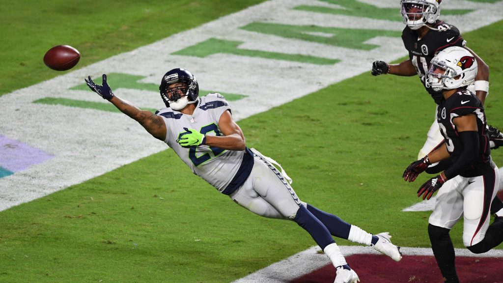 Quinton Dunbar #22 of the Seattle Seahawks attempts to make a diving interception during the second...