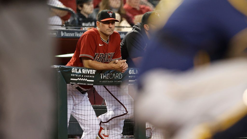 Manager Torey Lovullo #17 of the Arizona Diamondbacks watches from the dugout during the fourth inn...