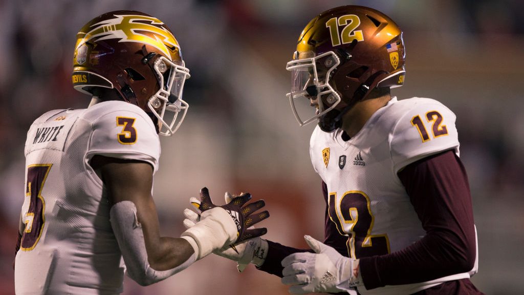 Rachaad White #3  of the Arizona State Sun Devils congratulates teammate Jalin Conyers #12 after he...