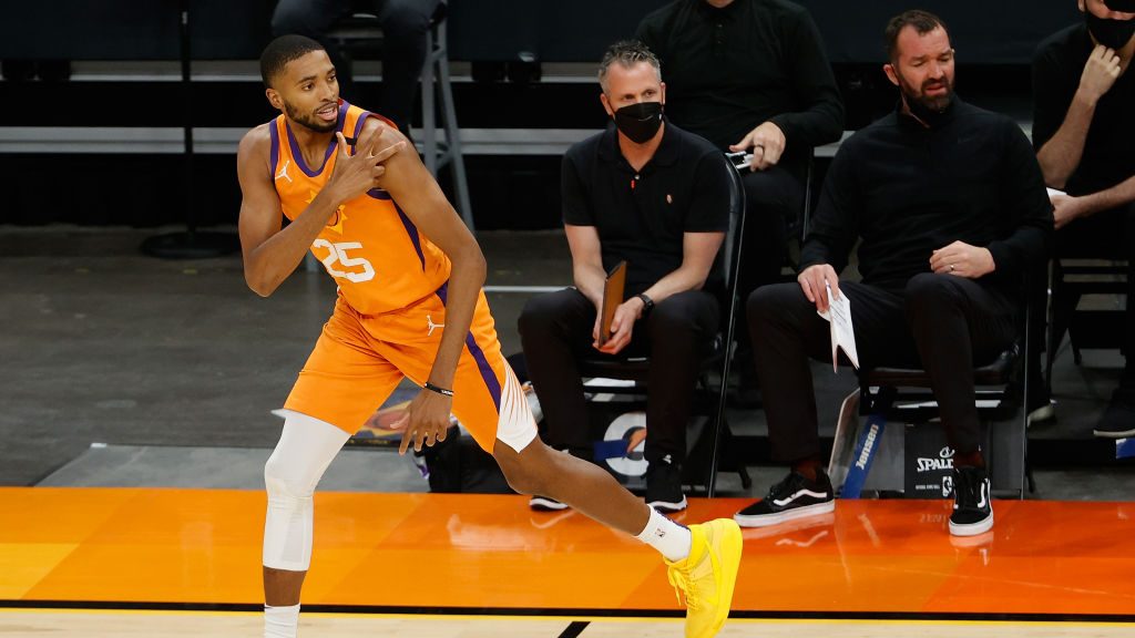 Mikal Bridges #25 of the Phoenix Suns reacts to three-point shot against the Utah Jazz during the f...