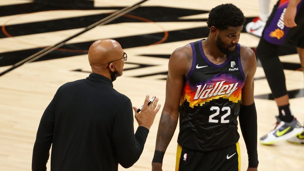 Head coach Monty Williams of the Phoenix Suns talks with Deandre Ayton #22 in the second half of ga...
