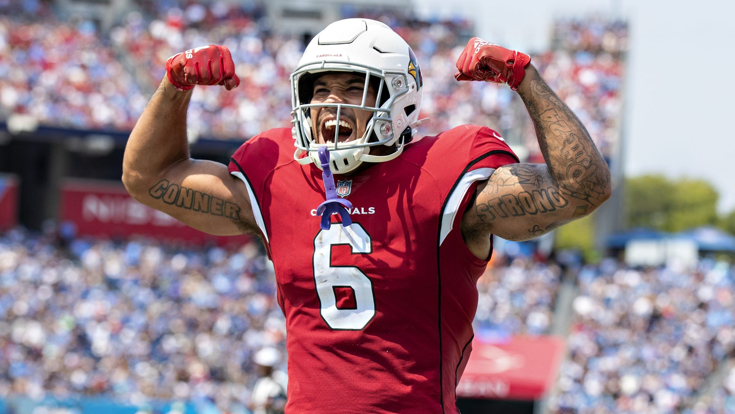 James Conner #6 celebrates with DeAndre Hopkins #10 of the Arizona Cardinals after a touchdown duri...