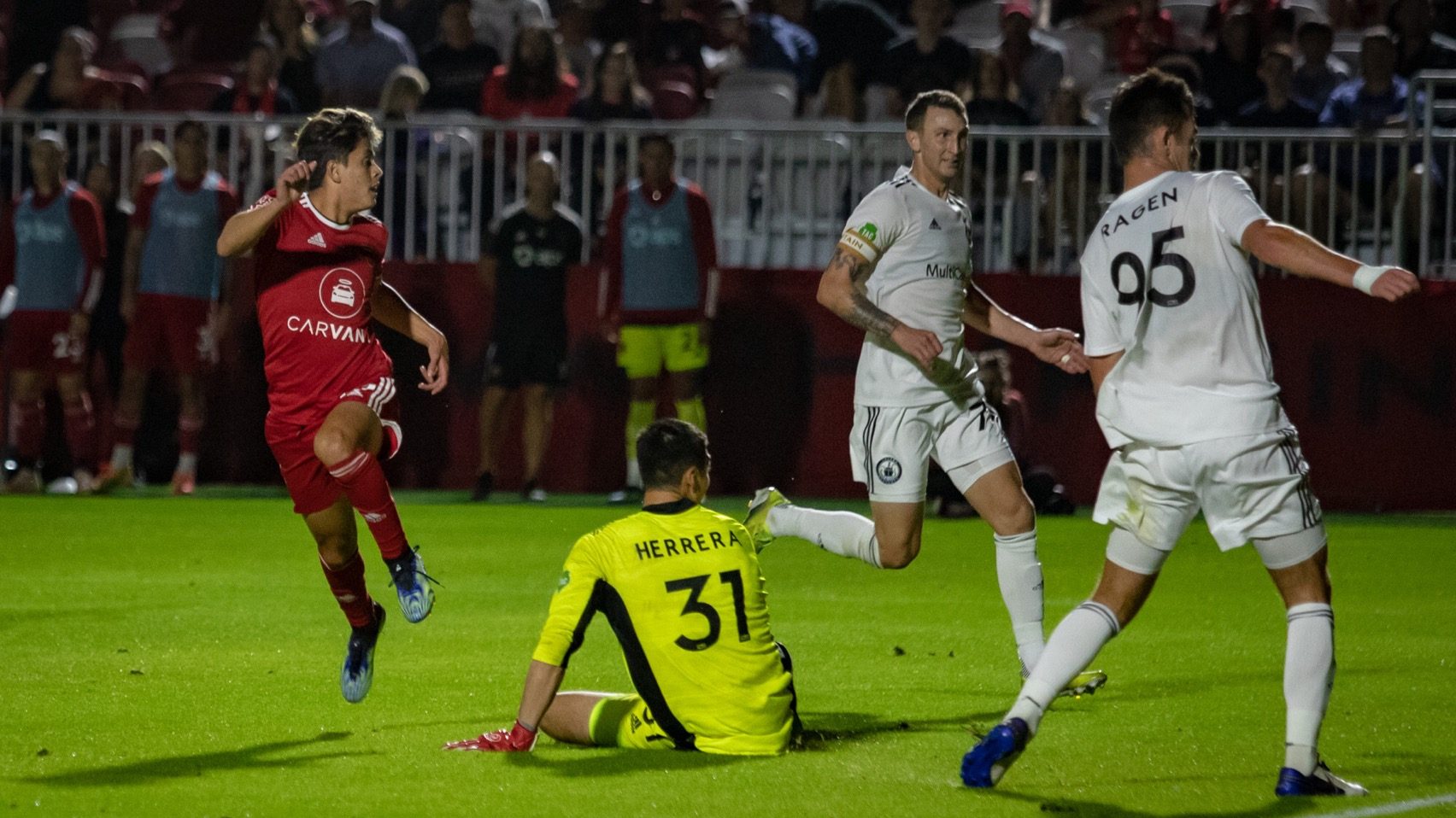 Phoenix Rising FC midfielder Arturo Rodriguez (left) scores against Tacoma Defiance in a 1-1 draw a...