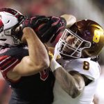 Utah tight end Dalton Kincaid, left, is tackled by Arizona State linebacker Merlin Robertson (8) after catching a pass during the first half of an NCAA college football game Saturday, Oct. 16, 2021, in Salt Lake City. (AP Photo/Rick Bowmer)