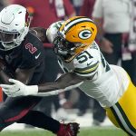 Arizona Cardinals running back Chase Edmonds (2) is hit by Green Bay Packers inside linebacker Krys Barnes (51) during the second half of an NFL football game, Thursday, Oct. 28, 2021, in Glendale, Ariz. (AP Photo/Rick Scuteri)