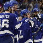 Tampa Bay Lightning center Alex Barre-Boulet, second from right, celebrates with teammates, including right wing Taylor Raddysh, left, after scoring against the Arizona Coyotes during the second period of an NHL hockey game Thursday, Oct. 28, 2021, in Tampa, Fla. (AP Photo/Chris O'Meara)