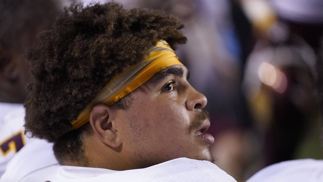 Arizona State offensive lineman Dohnovan West watches during the first half of the team's NCAA coll...