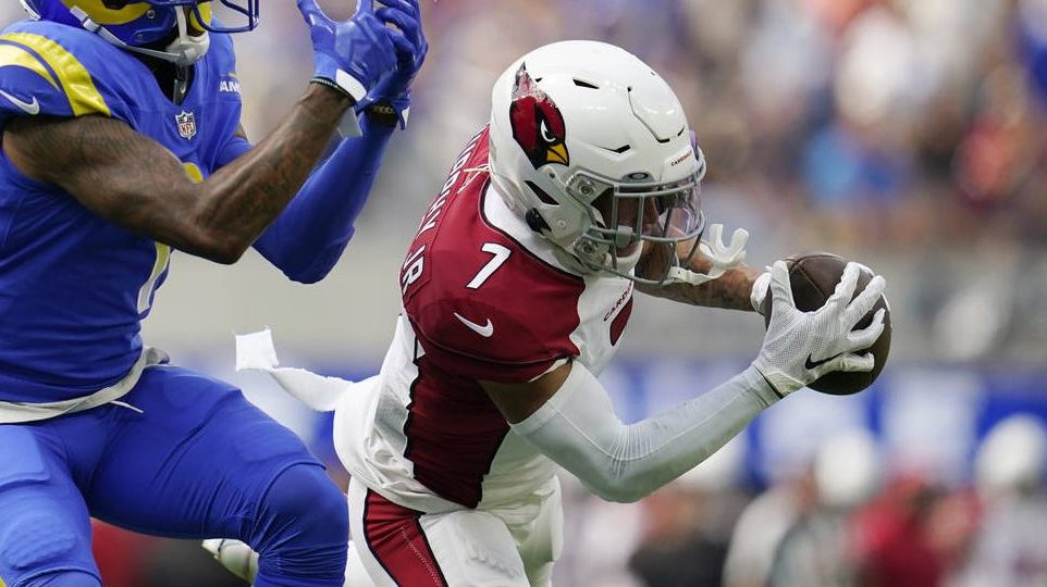 Arizona Cardinals cornerback Byron Murphy right, intercepts a pass intended for Los Angeles Rams wi...