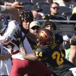 Washington State running back Max Borghi (21) hauls in a pass over Arizona State defensive back Chase Lucas (24) during the second half of an NCAA college football game, Saturday, Oct 30, 2021, in Tempe, Ariz. (AP Photo/Darryl Webb)