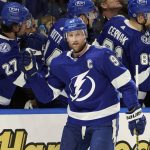Tampa Bay Lightning center Steven Stamkos (91) celebrates his goal against the Arizona Coyotes with the bench during the first period of an NHL hockey game Thursday, Oct. 28, 2021, in Tampa, Fla. (AP Photo/Chris O'Meara)
